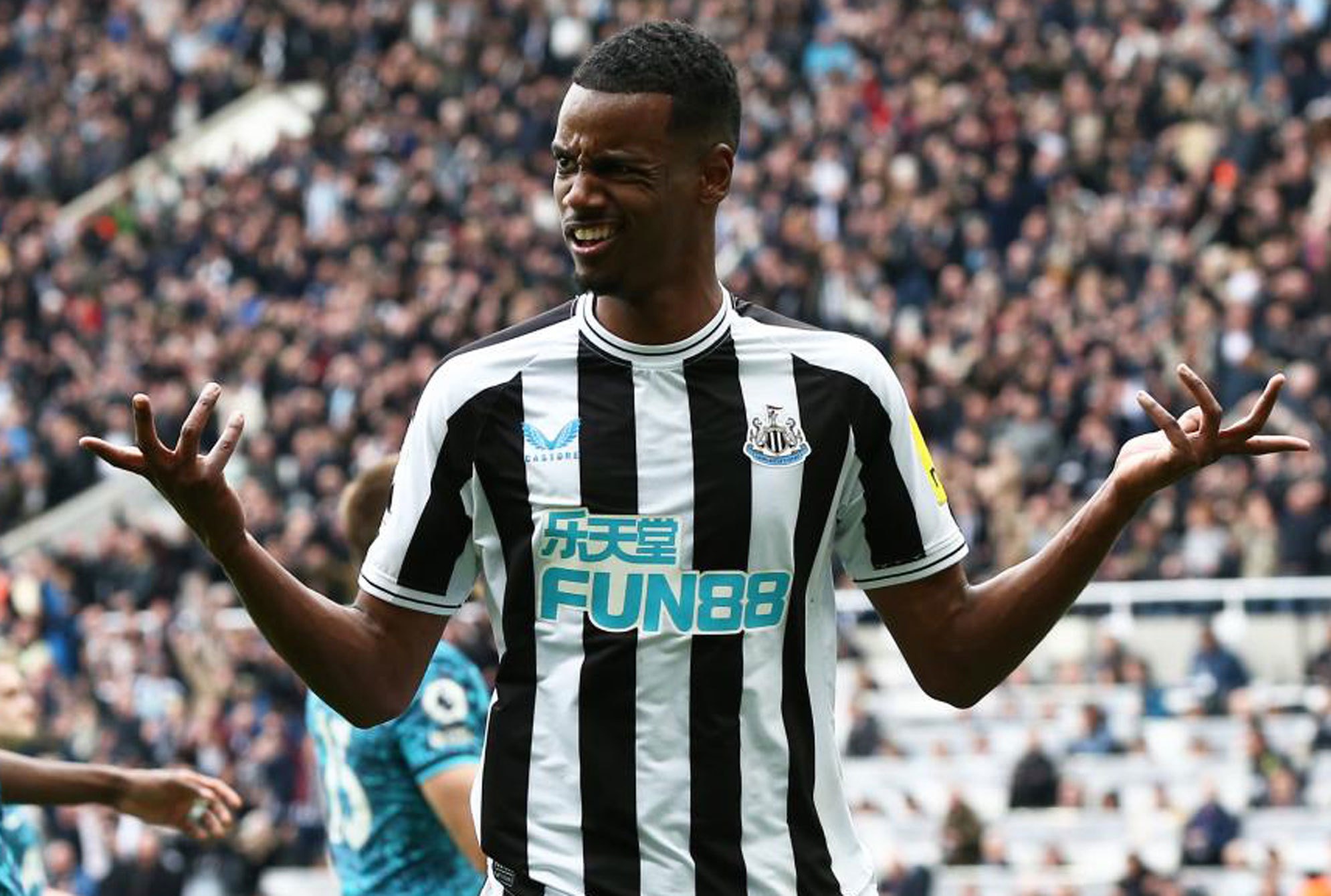 Alexander Isac celebrates a goal with Newcastle