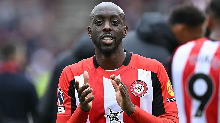 Yoane Wissa applauding Brentford's fans
