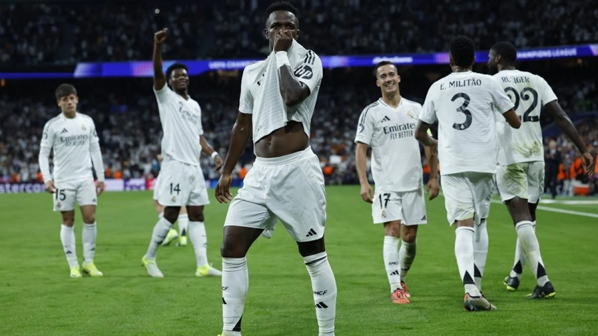 Vinicius celebrates one of Real Madrid's goals against Borussia Dortmund.