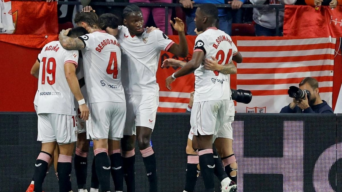 The players of Sevilla celebrate a goal
