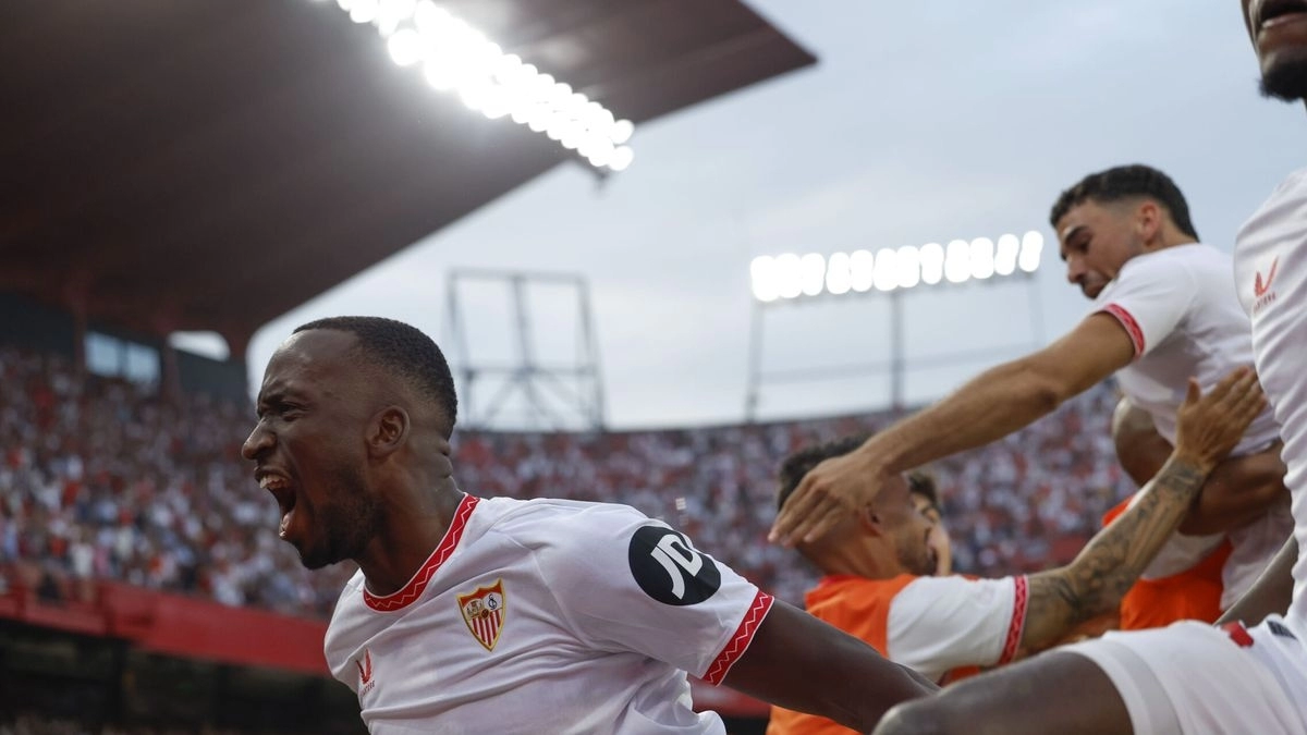 The Sevilla players celebrate a goal