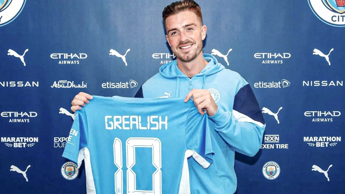 Jack Grealish posing as the new signing for Manchester City