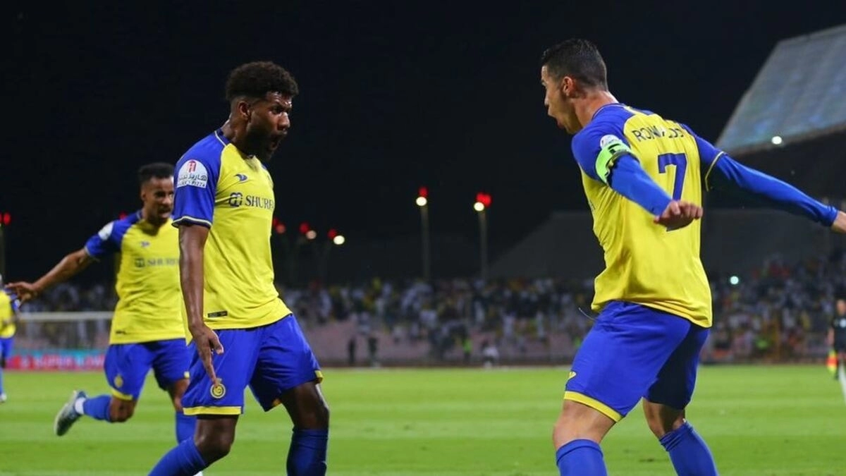 <p>The Al Nassr players celebrate a goal by Cristiano Ronaldo</p>