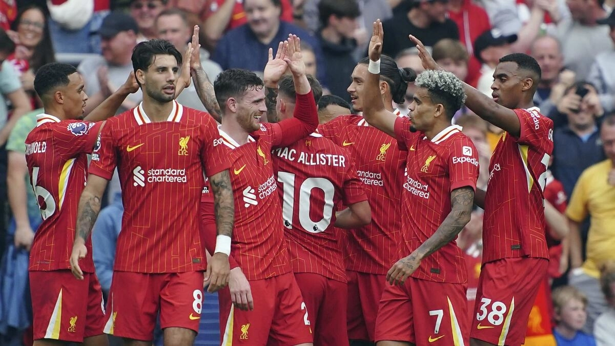 Liverpool players celebrate a goal.