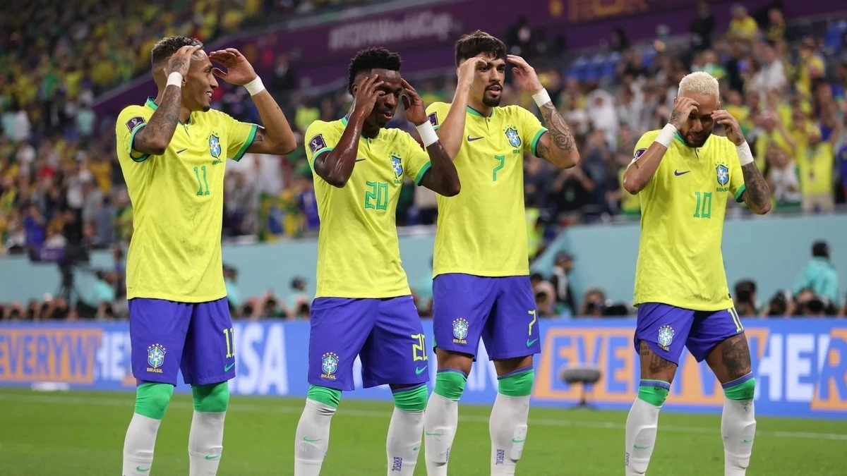 Brazilian players celebrate a goal