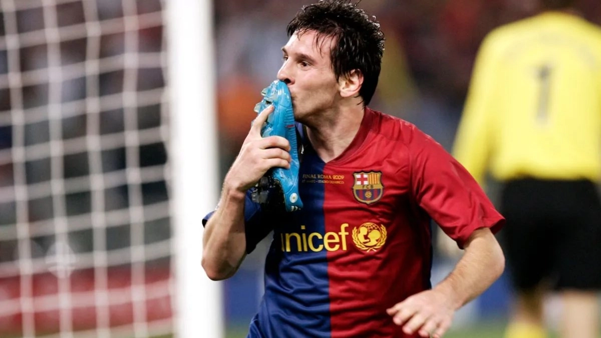 <p>Leo Messi celebrates a goal in a Champions League final</p>