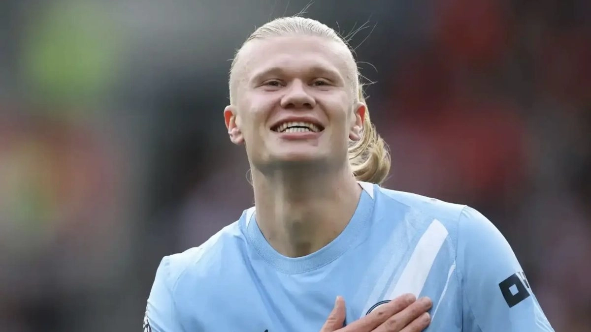 Erling Haaland celebrates a goal scored with Manchester City.