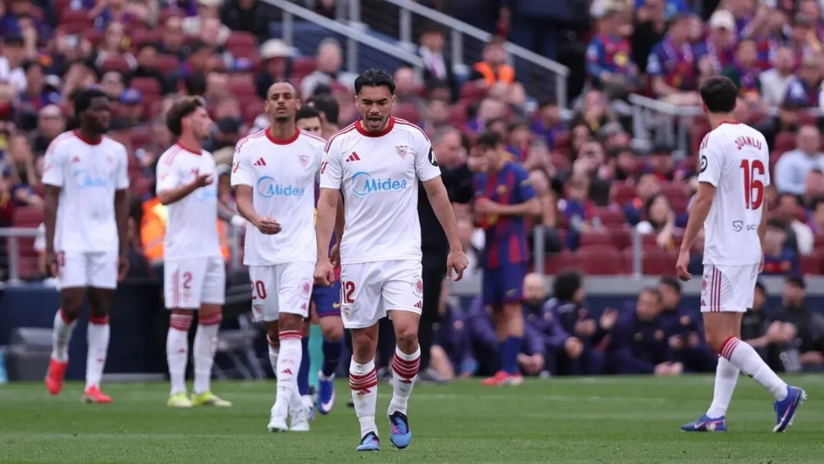 Sevilla players regret a goal against at the Camp Nou