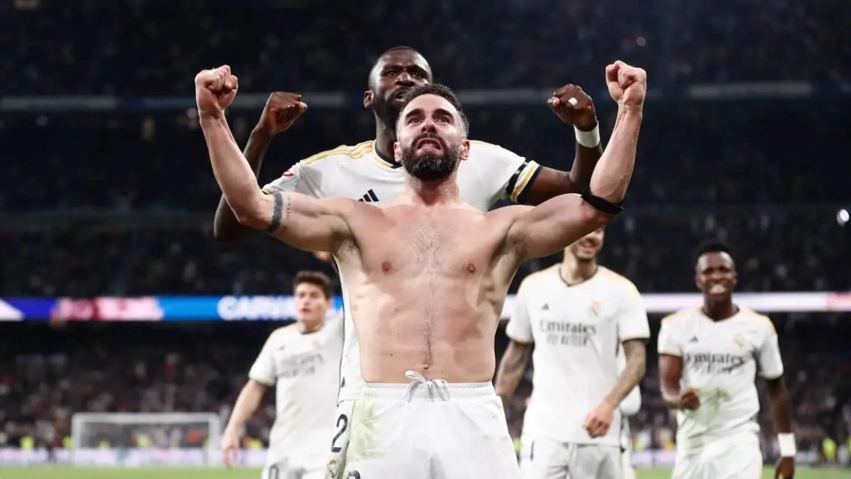<p>Dani Carvajal celebrates a goal with Real Madrid</p>