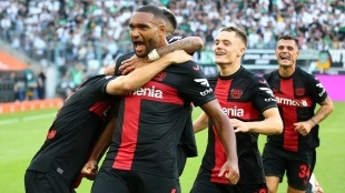 Jonathan Tah celebrates a goal scored with Bayer Leverkusen.