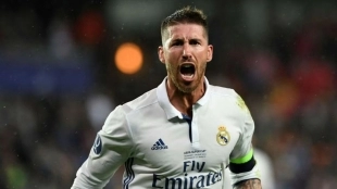 Sergio Ramos celebrates a goal wearing the Real Madrid shirt.
