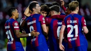 The Barcelona players celebrate a goal.