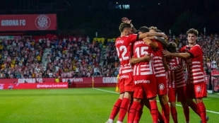 The Girona players celebrate a goal