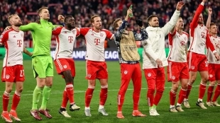 The players of Bayern Munich celebrate a victory with their fans