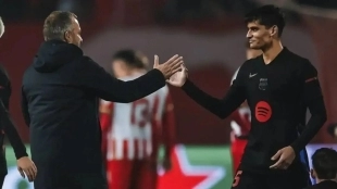 Hansi Flick greets Gerard Martín after a Barcelona match.